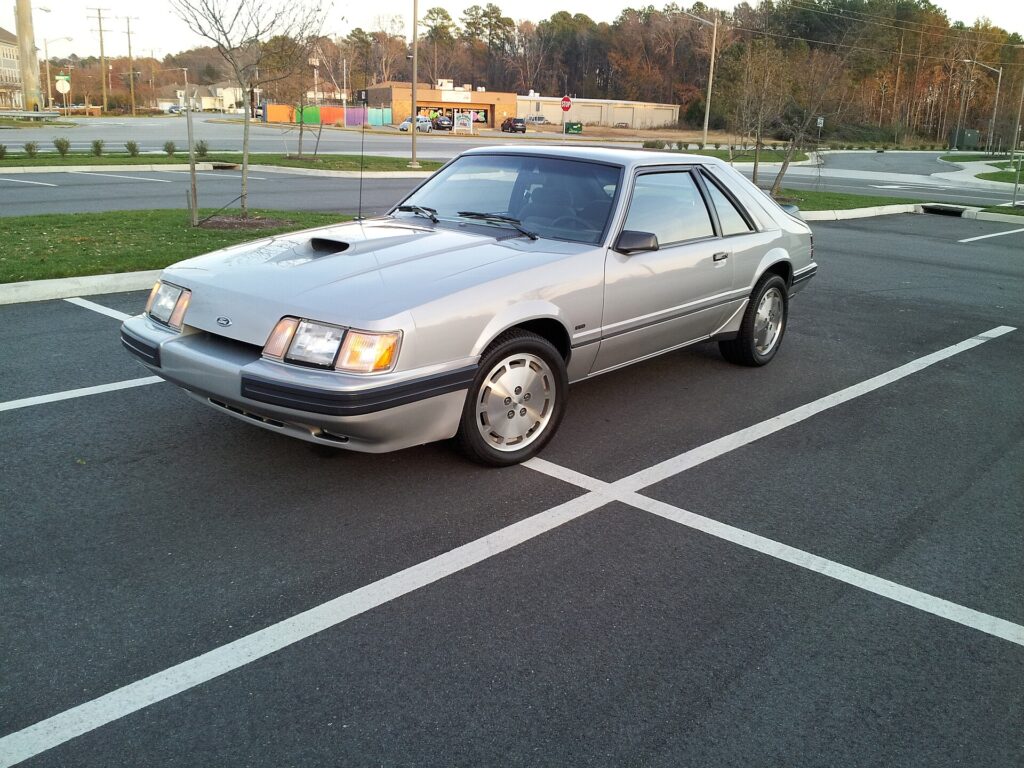 Gray 1986 Ford Mustang SVO with offset hood scoop
