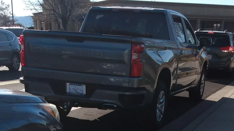 Gray 2021 Chevrolet Silverado 1500 RST crew cab parked on a street, rear three-quarter view