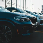 a row of cars parked in a parking lot