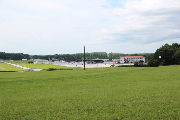 Atlanta Dragway grandstands and tower seen across a grassy field in Commerce, Georgia