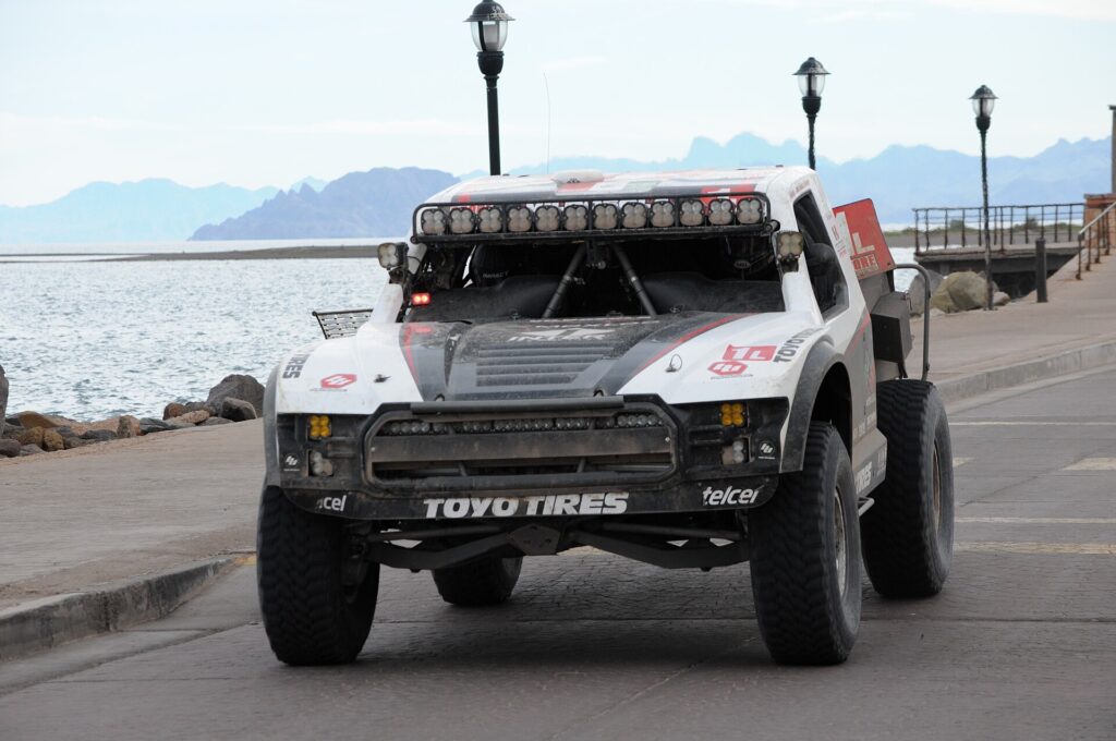 Toyo Tires-sponsored desert race truck parked on a seaside malecon during the 2023 Baja 1000