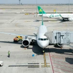 a large jetliner sitting on top of an airport tarmac