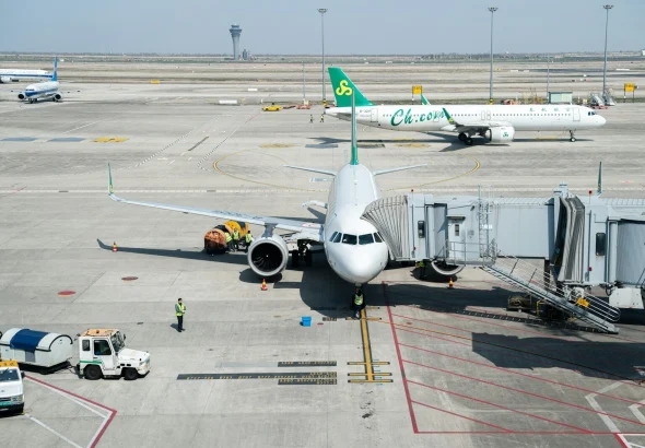 a large jetliner sitting on top of an airport tarmac