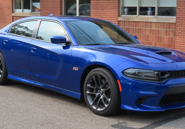 Indigo Blue 2021 Dodge Charger Scat Pack seen from the front right at a car show