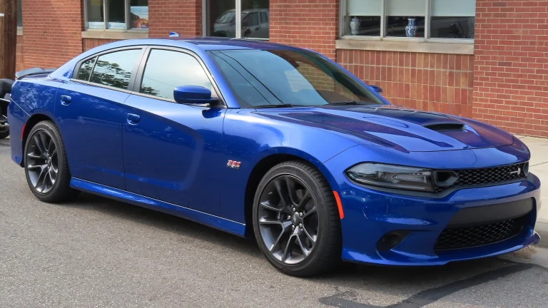 Indigo Blue 2021 Dodge Charger Scat Pack seen from the front right at a car show
