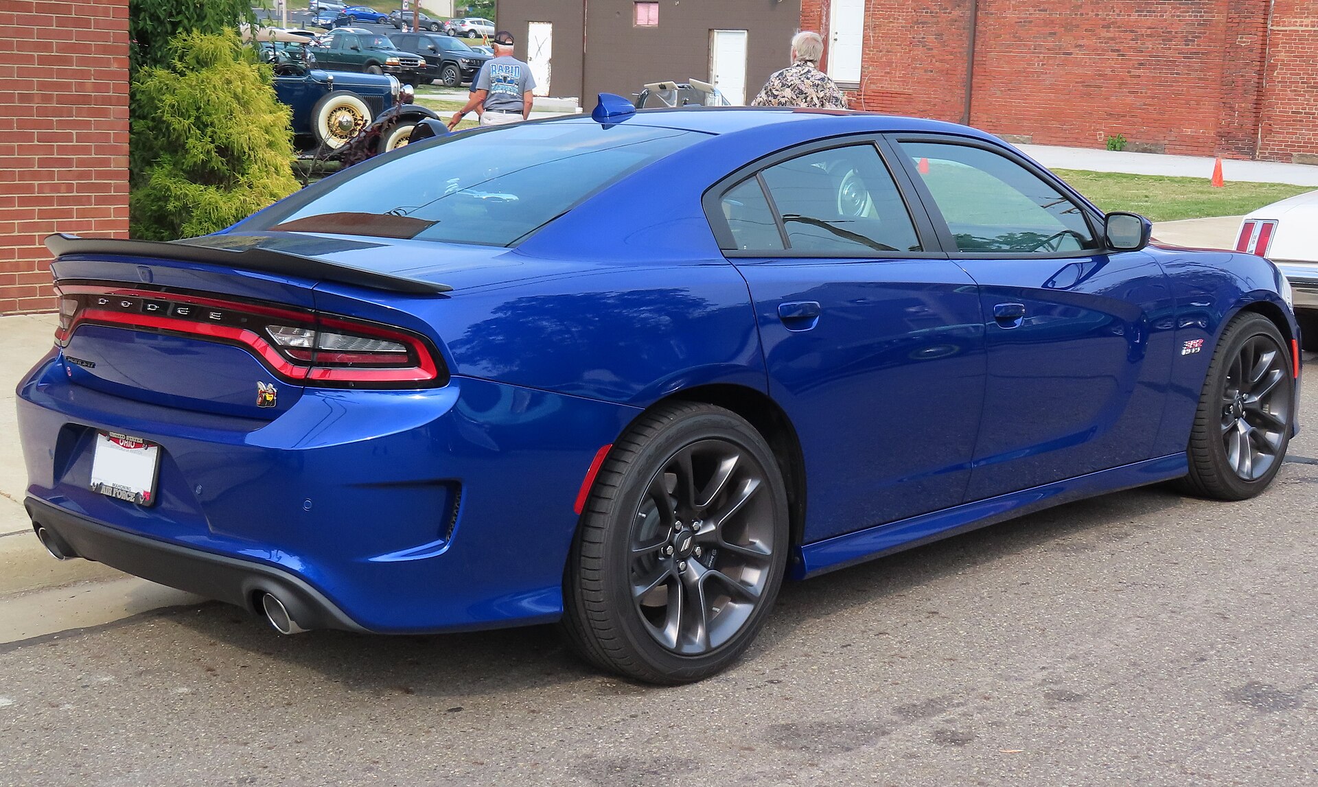 Rear right view of a blue 2021 Dodge Charger Scat Pack