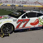 Carson Hocevar's No. 77 Spire Motorsports Chevrolet parked on the grid at Las Vegas Motor Speedway