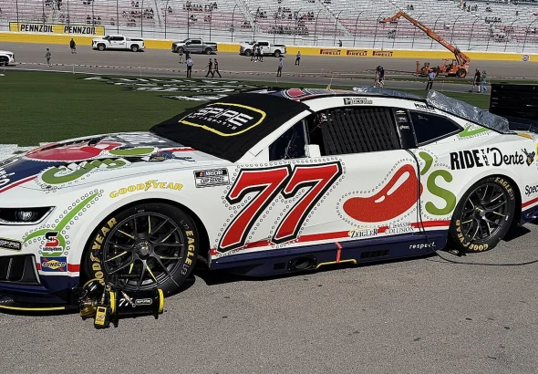 Carson Hocevar's No. 77 Spire Motorsports Chevrolet parked on the grid at Las Vegas Motor Speedway
