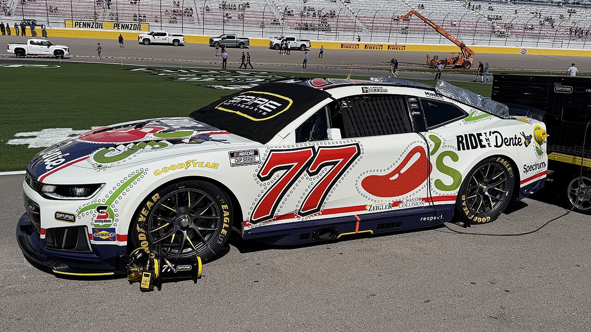 Carson Hocevar's No. 77 Spire Motorsports Chevrolet parked on the grid at Las Vegas Motor Speedway