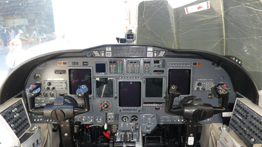 Two-seat flight deck of a Cessna Citation II business jet with duplicated instruments for captain and first officer