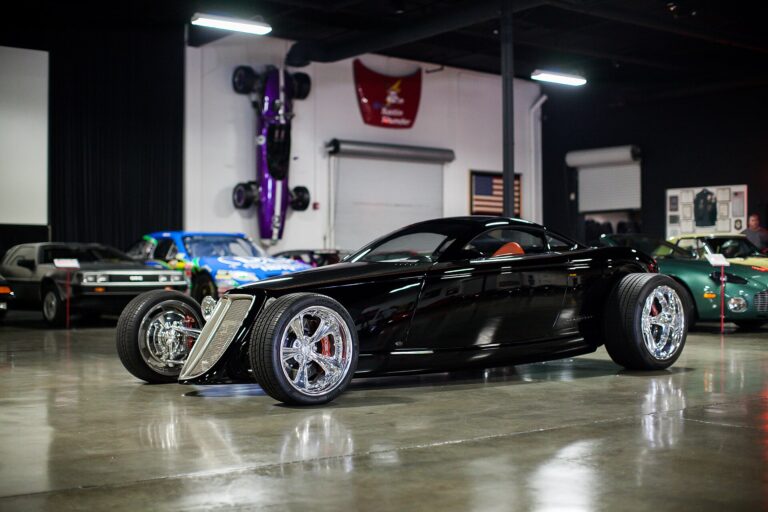 Black 2006 Foose Hemisfear hot rod coupe on display