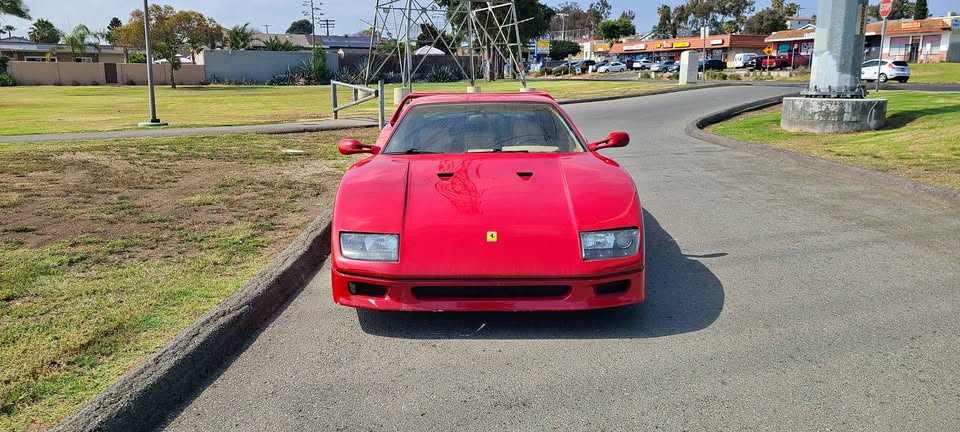 Front view of a red Ferrari F40 kit car built on a Pontiac Fiero, listed for sale in Chula Vista, California