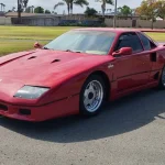 Front three-quarter view of a red Ferrari F40 kit car built on a Pontiac Fiero, listed for $35,000 in Chula Vista, California