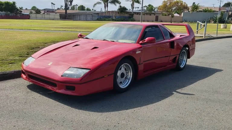 Front three-quarter view of a red Ferrari F40 kit car built on a Pontiac Fiero, listed for $35,000 in Chula Vista, California
