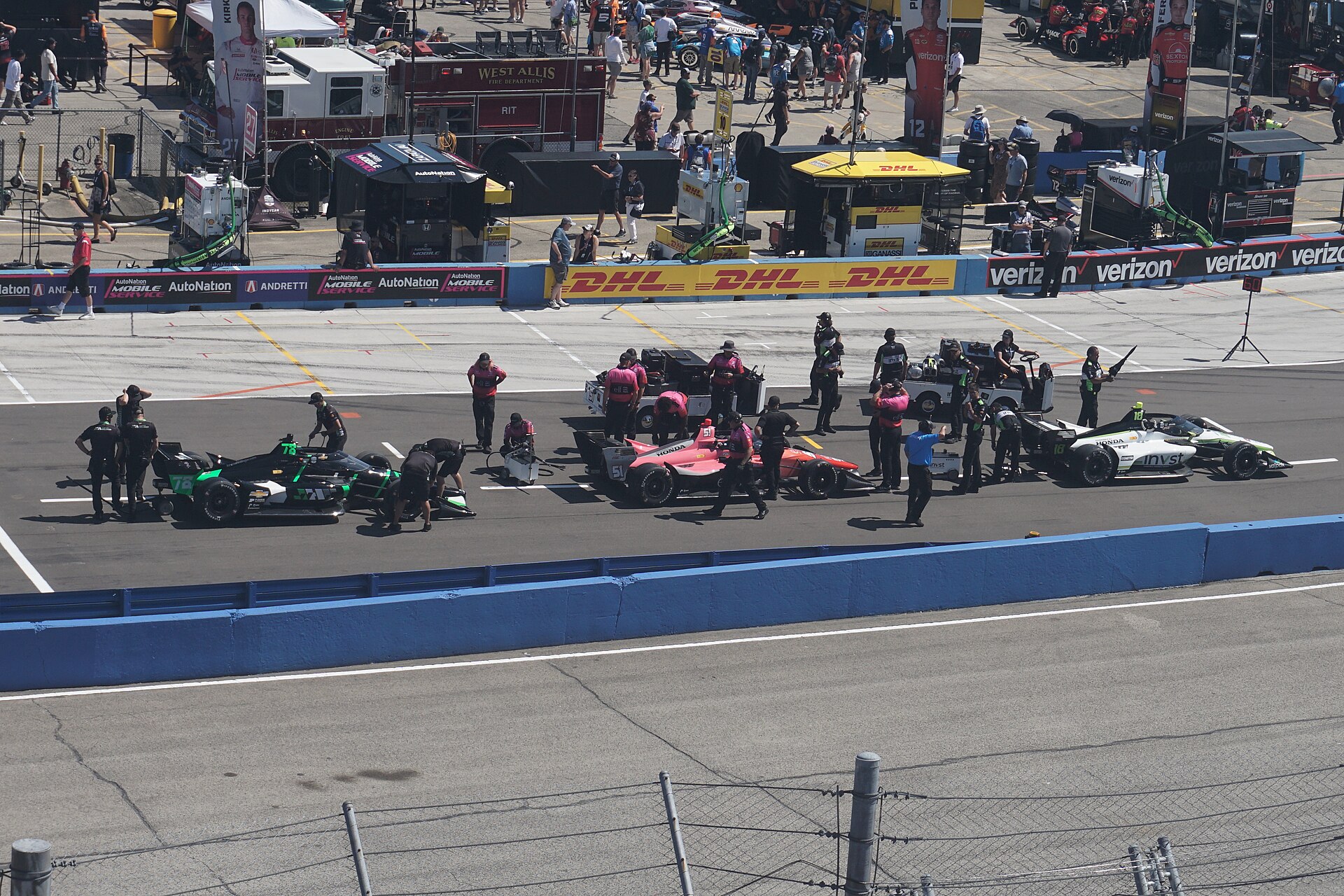 The cars of Conor Daly, Katherine Legge and Jack Harvey in the IndyCar qualifying line at the Milwaukee Mile in 2024