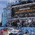 Corey Heim and his team pose in victory lane after winning the NASCAR Cup Series race at Naval Base Coronado