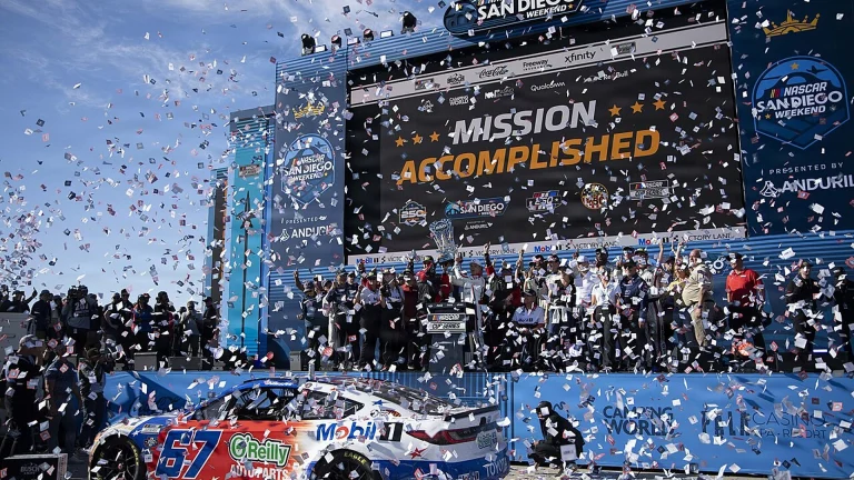 Corey Heim and his team pose in victory lane after winning the NASCAR Cup Series race at Naval Base Coronado
