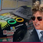 Tom Cruise beside the Mello Yello Chevrolet Lumina stock car from Days of Thunder