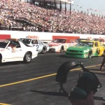 Stock cars on track at Phoenix International Raceway during filming of Days of Thunder in 1989