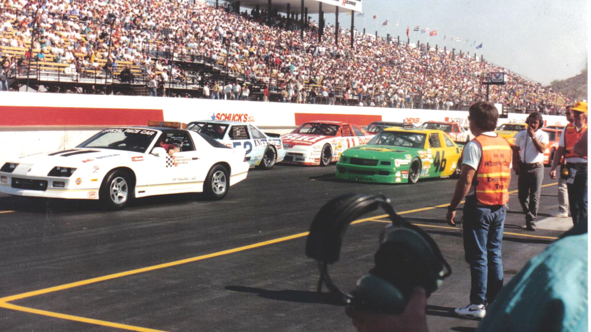 Stock cars on track at Phoenix International Raceway during filming of Days of Thunder in 1989