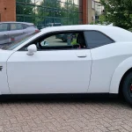 White Dodge Challenger SRT in side profile