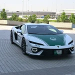 White and green Dubai Police Lamborghini Temerario parked on a paved plaza