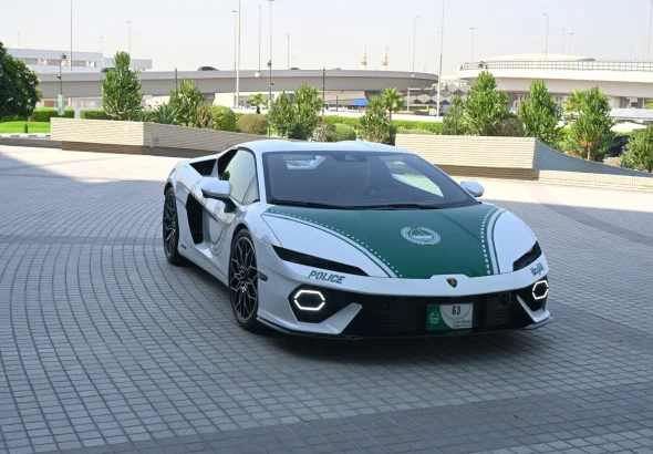 White and green Dubai Police Lamborghini Temerario parked on a paved plaza