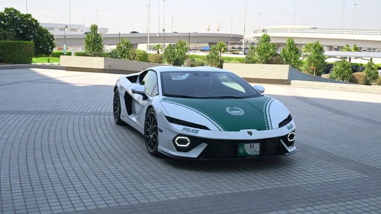 White and green Dubai Police Lamborghini Temerario parked on a paved plaza
