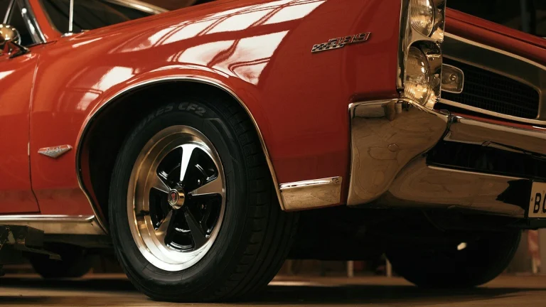 red and white car in a parking lot
