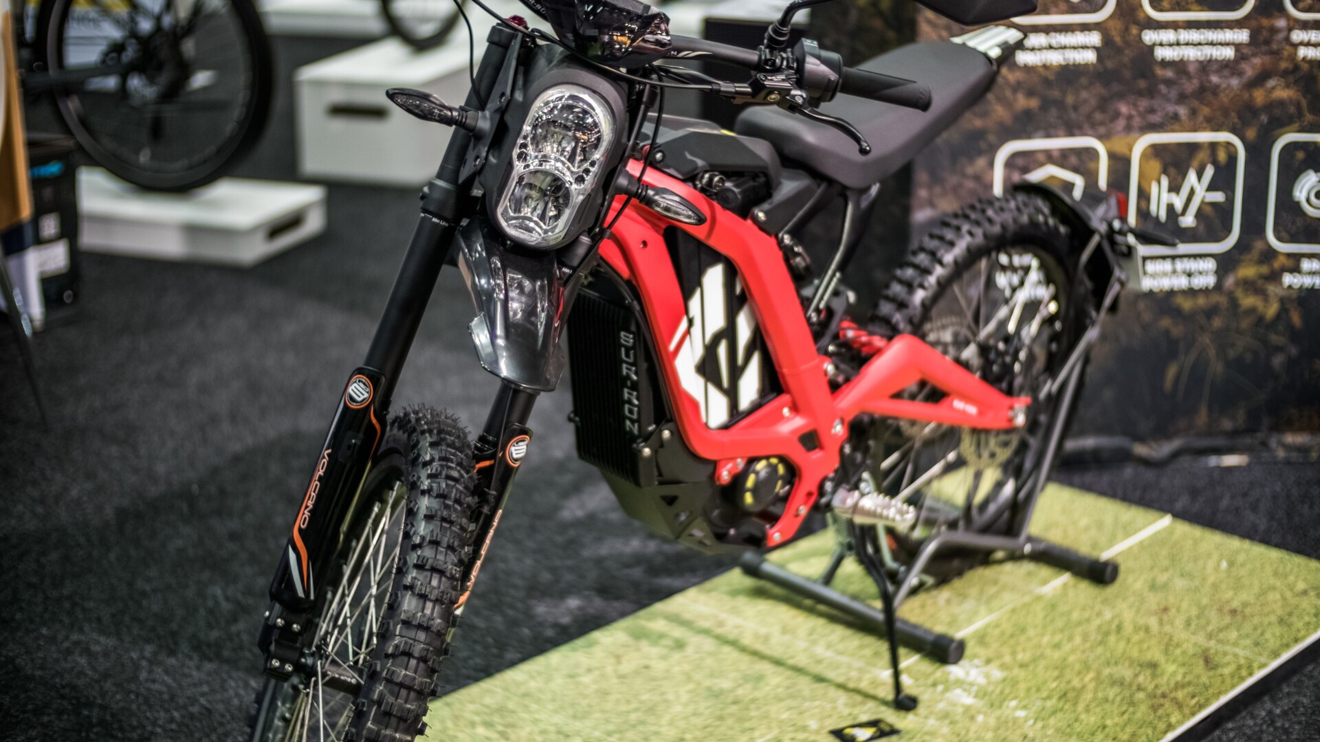 A red Sur-Ron electric dirt bike on display