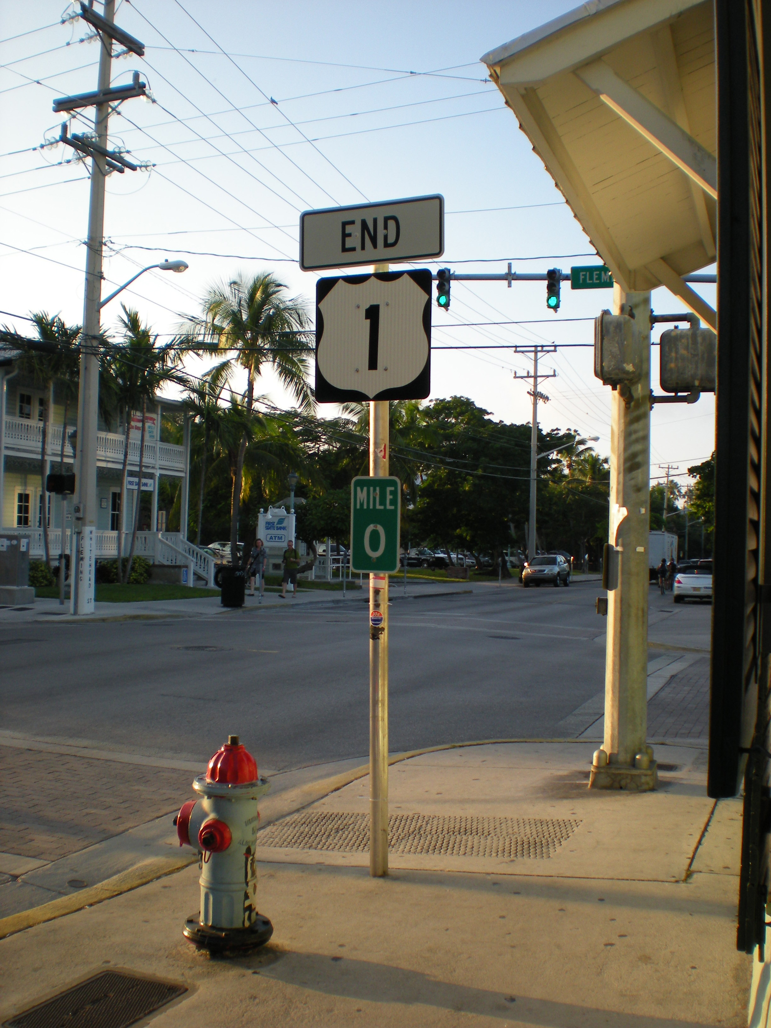 Small green mile marker sign along the Florida Keys Scenic Highway