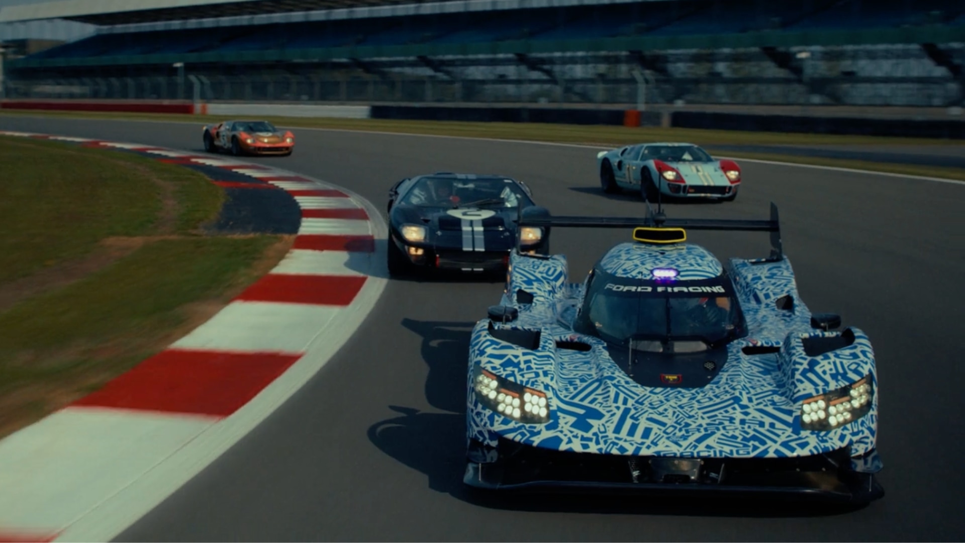 Ford Racing 2027 Hypercar in camouflage with the three 1966 Le Mans GT40 Mk IIs