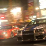 two cars driving down a city street at night