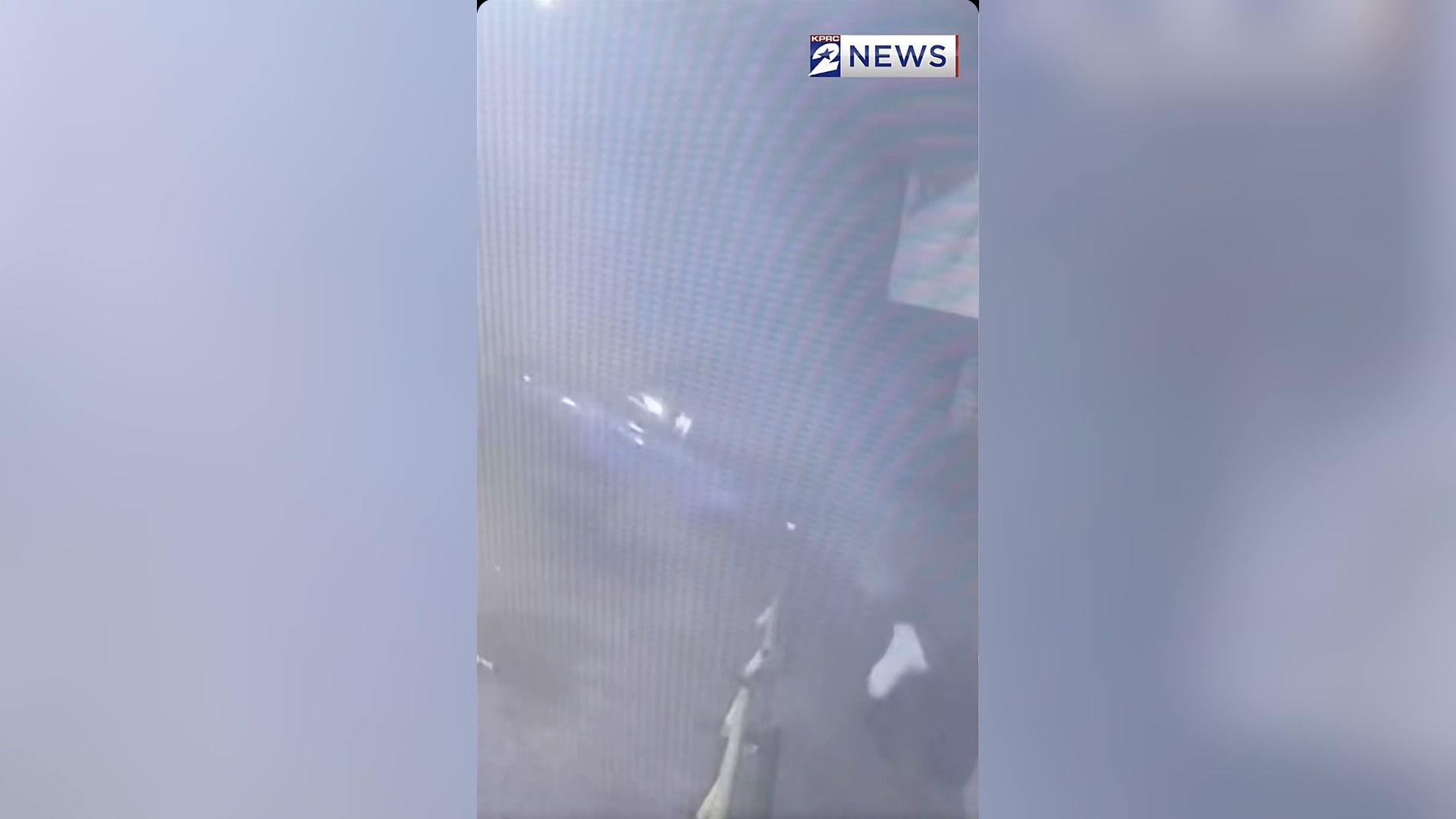 Surveillance video frame of a stolen car airborne next to a parked vehicle on Scott Street in Houston