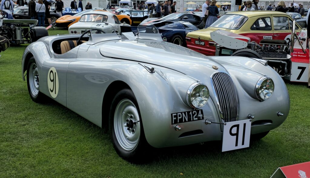 A silver 1951 Jaguar XK120 roadster
