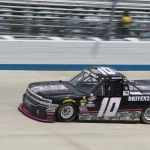 Jennifer Jo Cobb's No. 10 Chevrolet Truck Series pickup at speed during qualifying at Dover International Speedway in 2017