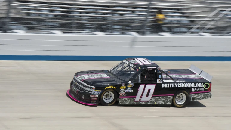 Jennifer Jo Cobb's No. 10 Chevrolet Truck Series pickup at speed during qualifying at Dover International Speedway in 2017