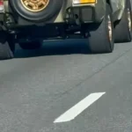 Video still of a Lamborghini LM002 driving on a Florida road from an Instagram post