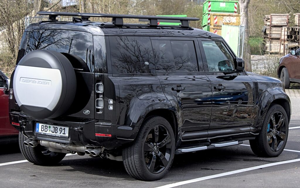 A black Land Rover Defender 110
