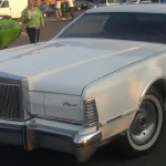 White Lincoln Continental Mark IV parked in a Montreal lot