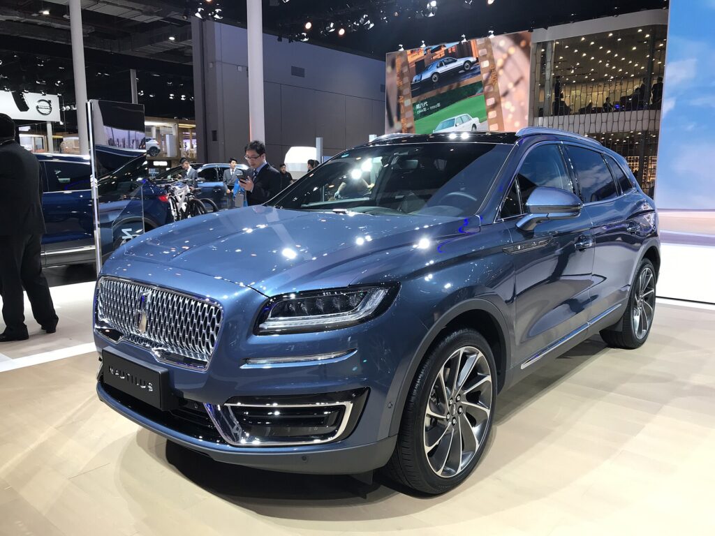 A blue Lincoln Nautilus SUV on display at an auto show