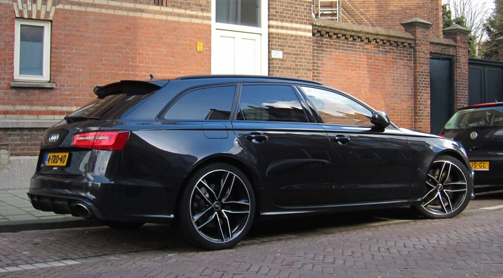 Black C7-generation Audi RS6 Avant parked on a street