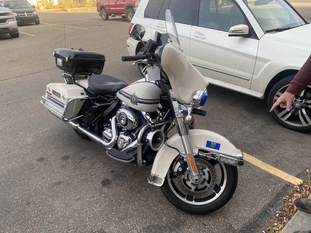 A white police-spec Harley-Davidson Electra Glide motorcycle