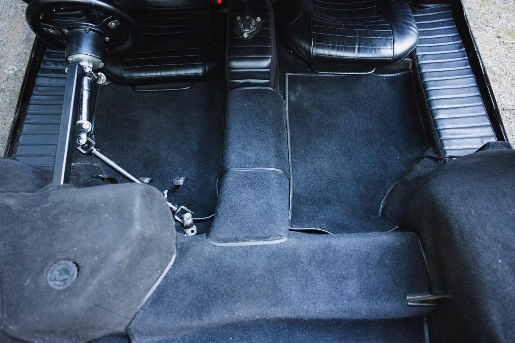 Black vinyl bucket seats and right-hand-drive steering column in the Stratos Zero re-creation