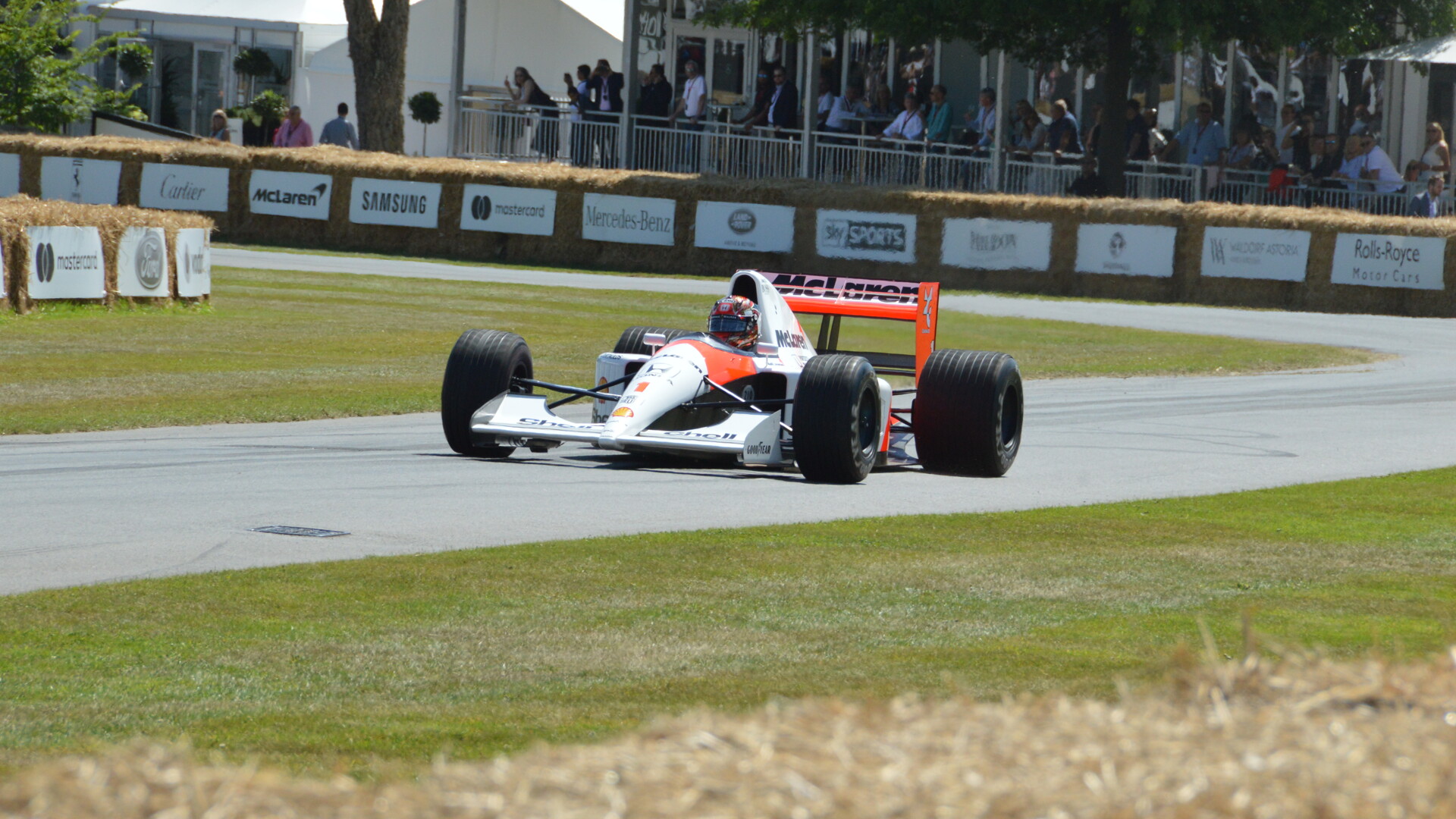 McLaren MP4/6 Formula 1 car with Marlboro-style red and white livery on track