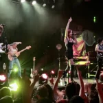 MUNA performing on stage at First Avenue in Minneapolis in 2022
