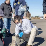 NTSB investigators recover the cockpit voice recorder from the Cessna Citation wreckage at Statesville Regional Airport