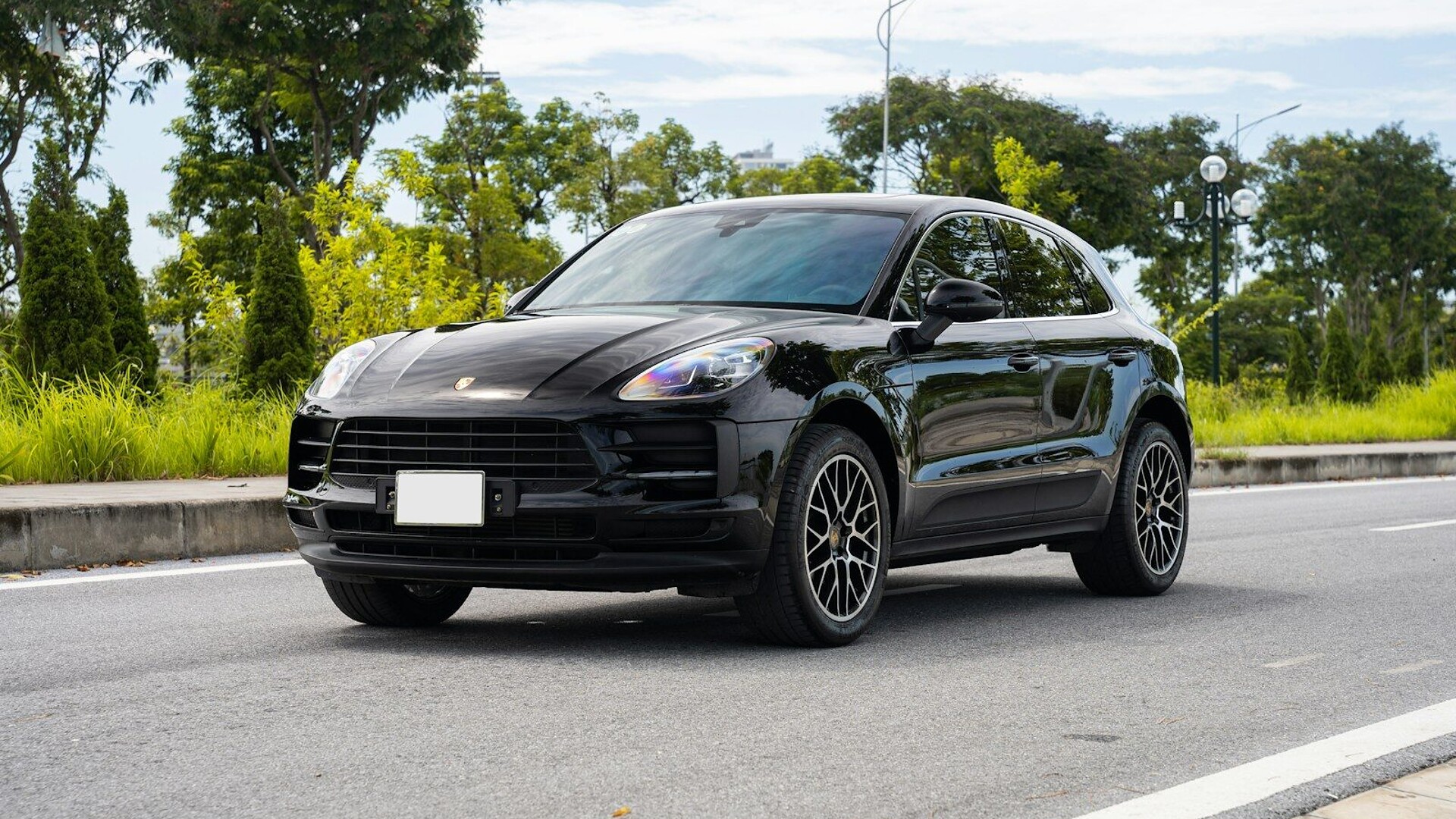 a black car parked in a parking lot