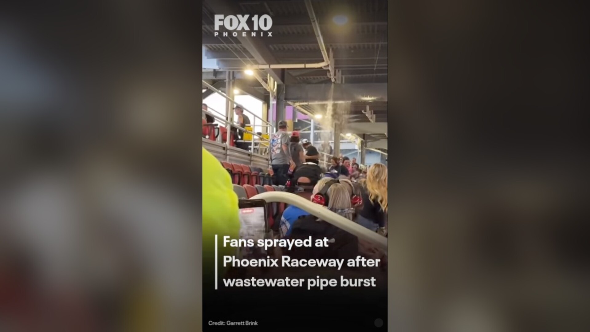Wastewater sprays from a broken overhead pipe onto fans in the Phoenix Raceway grandstand