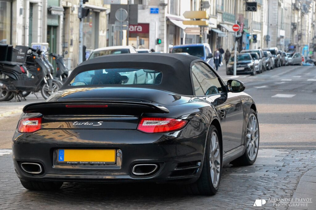 A black Porsche 997 911 Turbo S Cabriolet